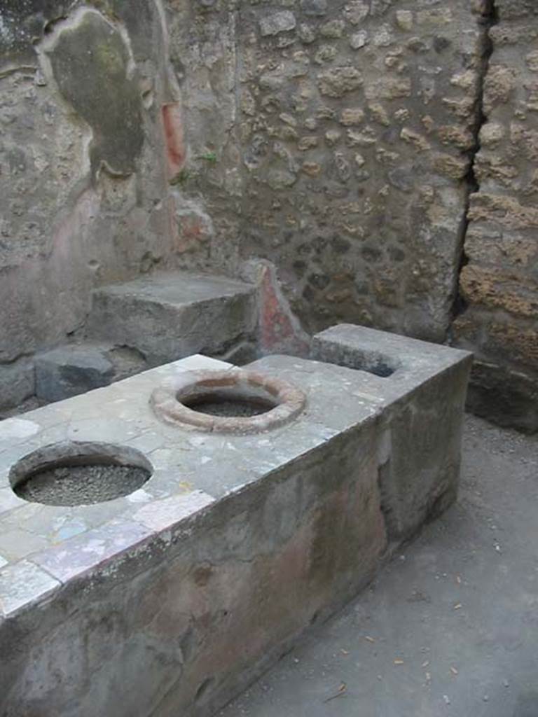 IX.7.13 Pompeii. May 2003. Looking across counter towards steps in north-west corner.  Photo courtesy of Nicolas Monteix.
