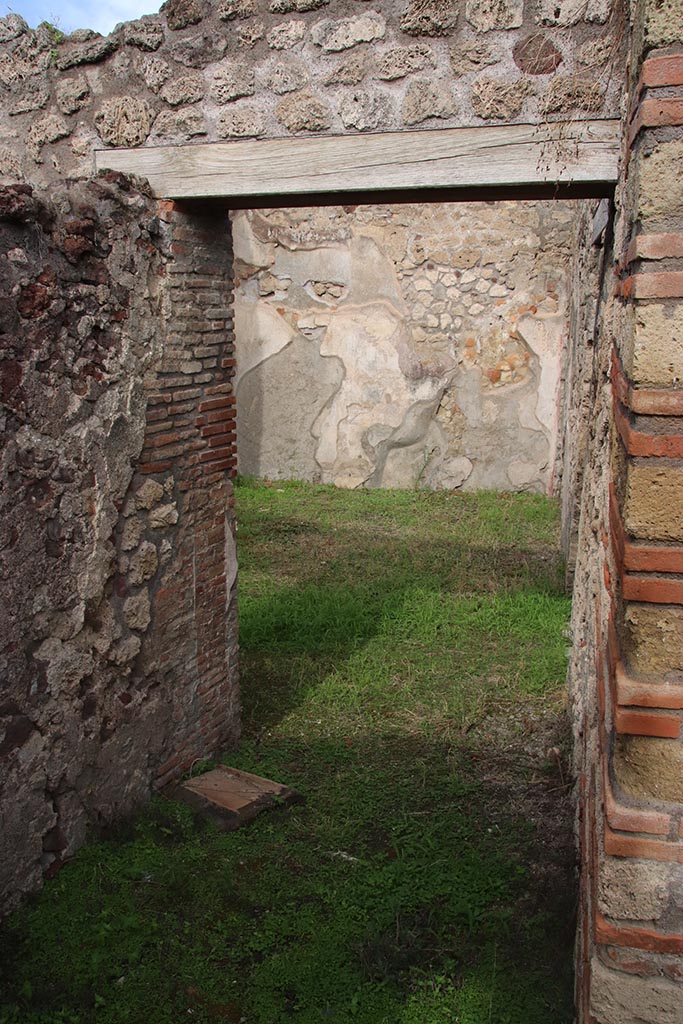 IX.7.19 Pompeii. October 2024. 
Corridor f, looking north through doorway into atrium b, and across into ala c.
Photo courtesy of Klaus Heese.
