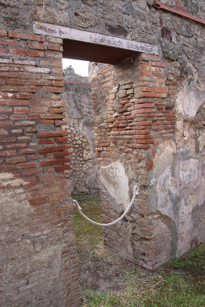 IX.7.19 Pompeii. October 2024. 
Doorway into room e, in east wall of atrium b, leading into rear room of IX.7.18.
Photo courtesy of Klaus Heese.
