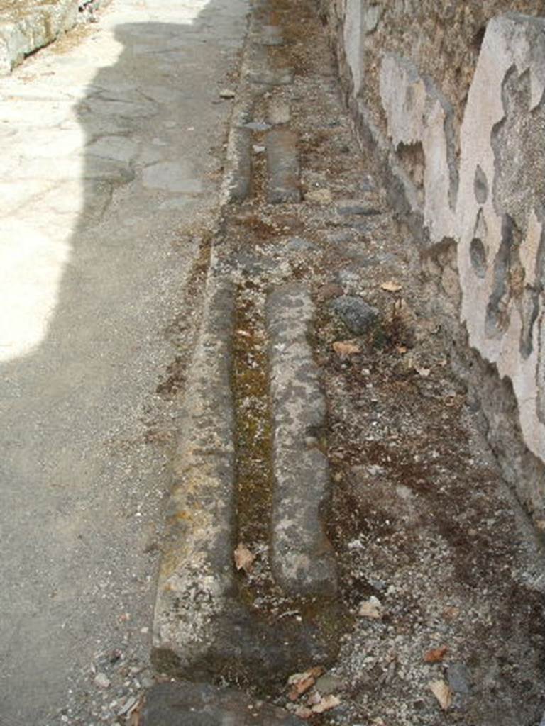 Street gutter and pavement outside IX.7.20. May 2005.
