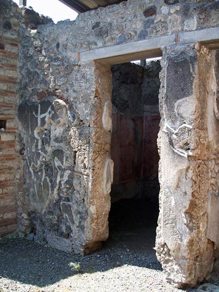 IX.7.20 Pompeii. May 2005. 
Doorway to room (c), cubiculum on south side of street entrance doorway.
