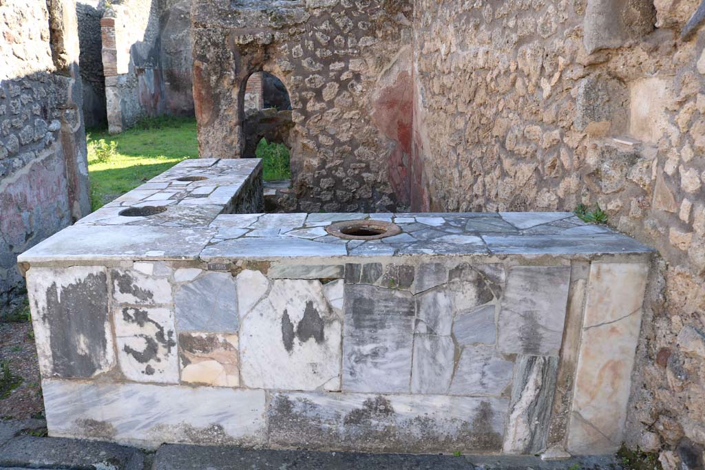 IX.7.24 Pompeii. December 2018. Looking south across counter. Photo courtesy of Aude Durand.