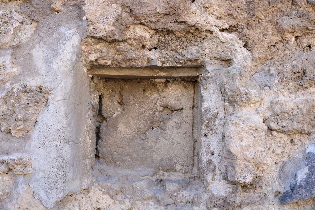 IX.7.24 Pompeii. December 2018. Looking towards square upper niche in west wall at end of counter. Photo courtesy of Aude Durand.

