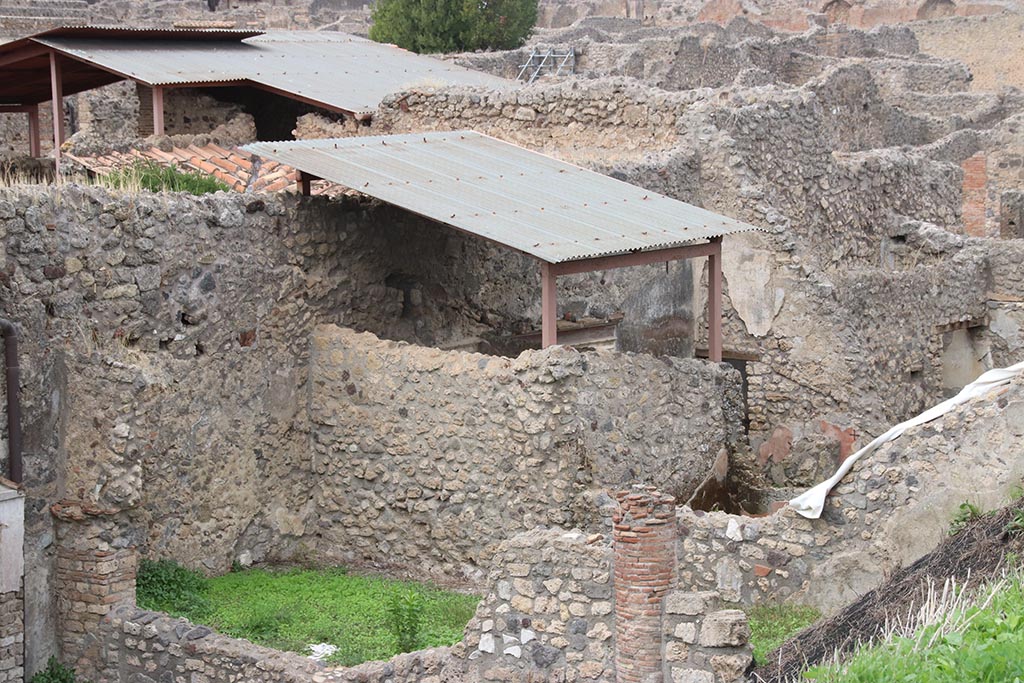 IX.7.25 Pompeii. October 2024. 
Looking north-west towards room “v” and “u”, both under roof, taken from above IX.7.12. Photo courtesy of Klaus Heese.
