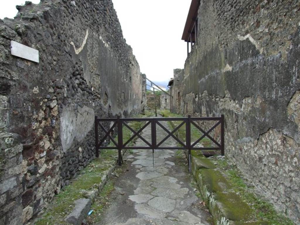 IX.8.1 Pompeii . March 2009. Looking south along Vicolo del Centenario. 
According to Not. Scavi,1880,p.298-299 “In the beginning of July the digging of the upper soil situated to the east of insula 5 and 6 of Reg. IX began……  In August began the excavation of the vicolo on the east of this insula, and the following painted inscriptions appeared: Found at the north-east corner of the vicolo, the side that looked onto the vicolo (on the right), painted on rough plaster in red letters –

N. Herennium Celsum
d.v.v.a.s.p.p.d.r.p.o.v.f ///st
According to Epigraphik-Datenbank Clauss/Slaby (See www.manfredclauss.de), this is CIL IV 3771, and read as -
N(umerium)  Herennium  Celsum 
d(uum)v(irum)  v(iis)  a(edibus)  s(acris)  p(ublicis)  p(rocurandis)  d(ignum)  r(ei)  p(ublicae)  o(ro)  v(os)  f(aciatis)  d(ignus?)  est      [CIL IV 3771]

Found on the east side of the vicolo (on the left), on white rough plaster in red letters –
Nepote
According to Epigraphik-Datenbank Clauss/Slaby (See www.manfredclauss.de), this is CIL IV 3823, and read as -
Nepote      [CIL IV 3823]

