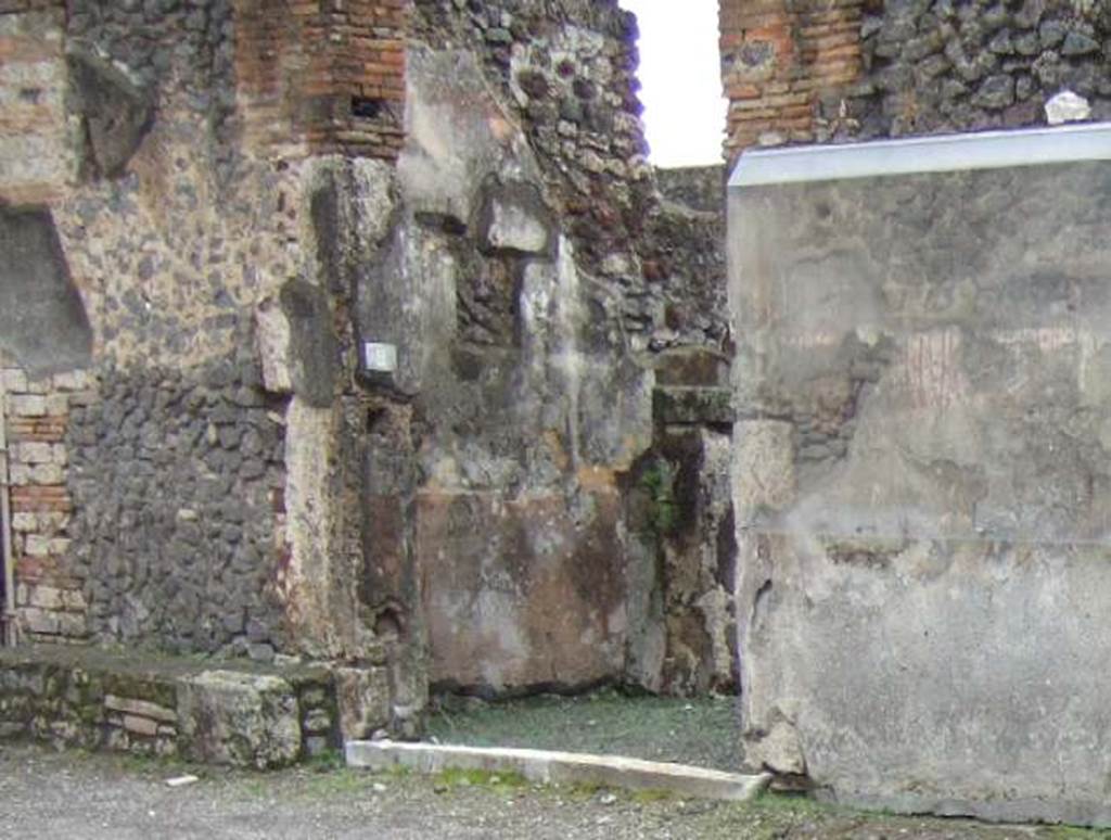 IX.8.2 Pompeii. December 2005. Entrance with painted graffiti on the west side.