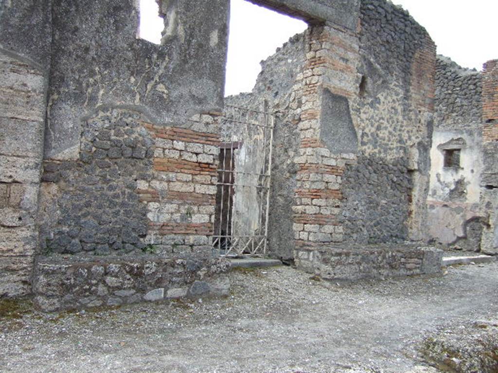 IX.8.3 Pompeii. May 2006. Entrance doorway, with seats on both sides.