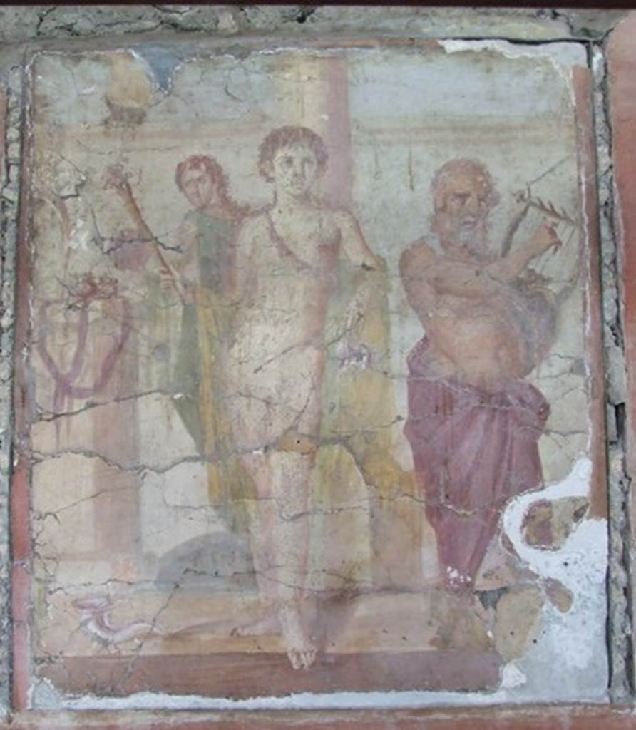 IX.8.6 Pompeii. December 2007. Room 38, triclinium, east wall. Wall painting of Hermaphrodite with Bacchus and Silenus. Hermaphrodite has a torch raised in the right hand and a kantharos (cup) in the left hand. The Maenad has a tamburello (tambourine) and Silenus has his lyre. See Sogliano, A., 1879. Le pitture murali campane scoverte negli anni 1867-79. Napoli: Giannini. (No. 596).