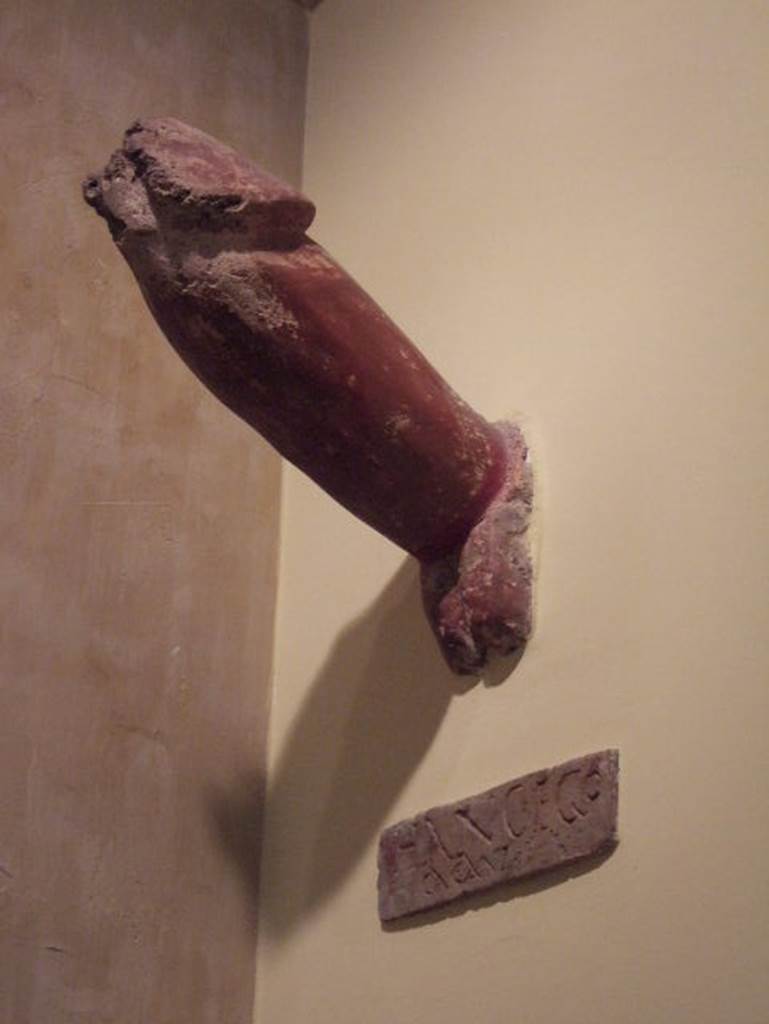 IX.8.6 Pompeii. Phallus. Now in Naples Archaeological Museum.  Inventory number 113415.
According to BdI, fixed into the external side of the east wall of the house was a very large tufa phallus, painted in red with the inscription 
HANC . EGO
      CACAVI
See Bulletino dell’Instituto di corrispondenza archaeologica, 1882, p.115
