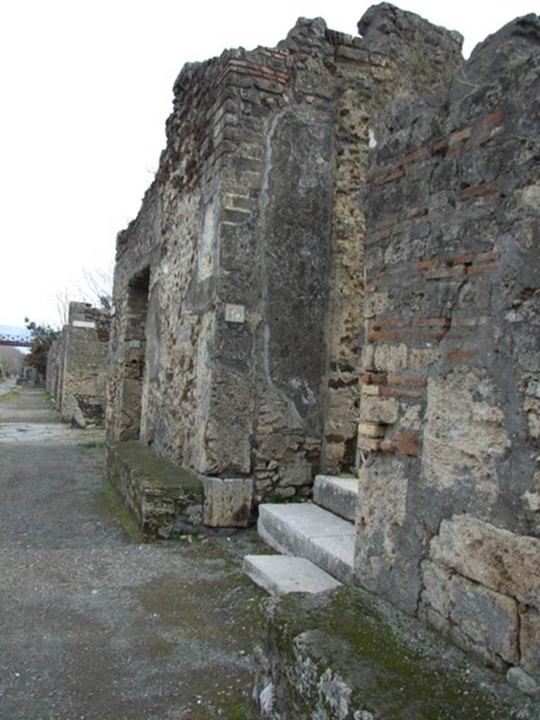 IX.8.6 Pompeii.  December 2007.  Entrance on Via Nola, looking east. According to Della Corte, this magnificient dwelling, belonged to the Verus family. According to the graffiti written on the façade, this was A. Rustius Verus, noted as aedile and duumvir candidate.
Another mentioned was Ti. Claudius Verus, who held the position of supreme magistrate for the year 61-62. Much graffiti was found on the façade, especially between IX.8.6 and 7, for this see IX.8.7.
See Della Corte, M., 1965.  Case ed Abitanti di Pompei. Napoli: Fausto Fiorentino. (p.133)  
