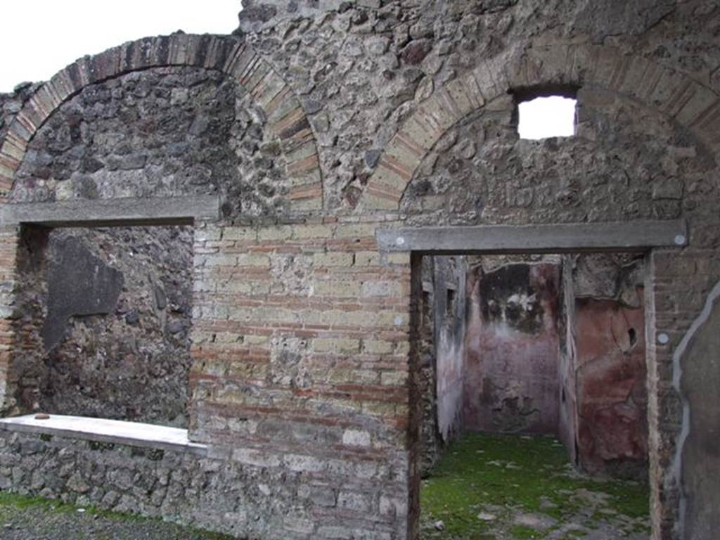 IX.8.6 Pompeii. March 2009.  Doorway to Room 20, window to Room 21, and south wall of Portico.