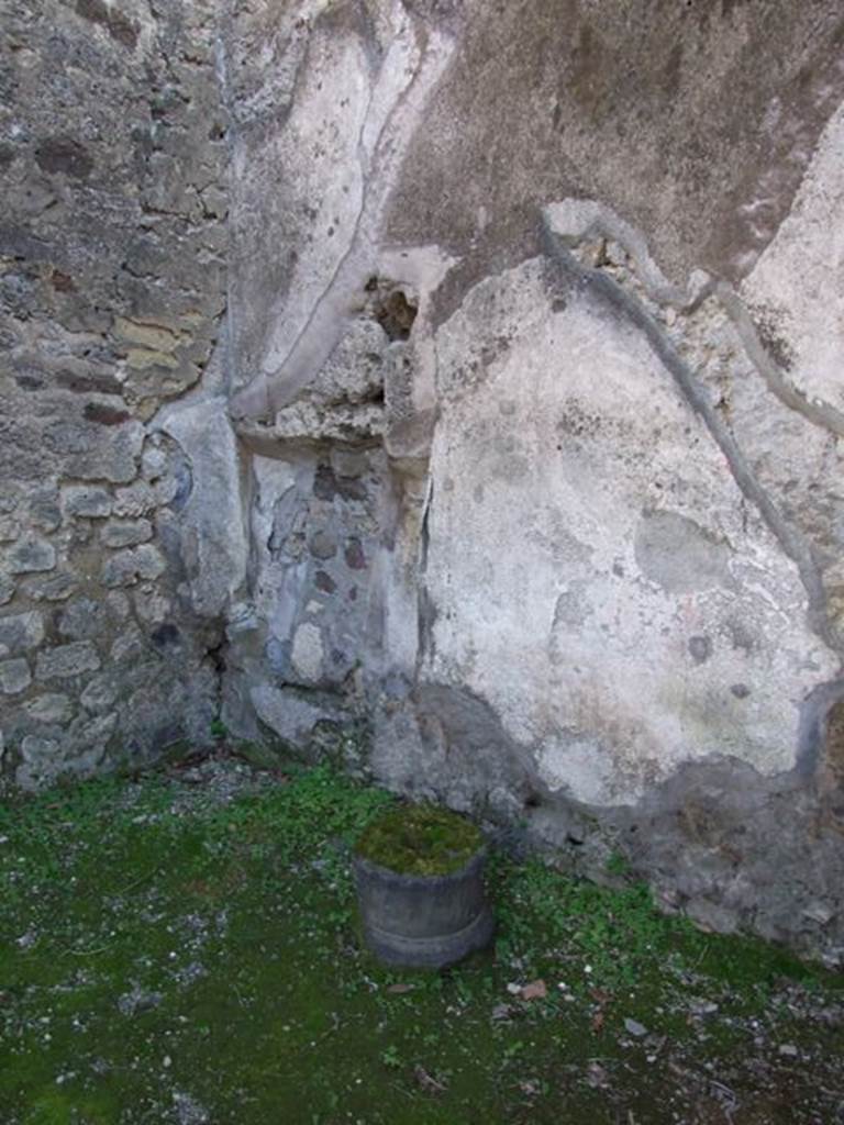IX.8.7 Pompeii. March  2009.  Niche in south east corner, under line of stairs in rear wall.