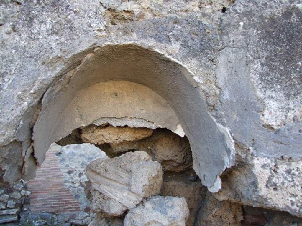 IX.9.1 Pompeii. March 2009. Remains of niche. Boyce described it as a vaulted niche with white stucco coating the inside walls. He quoted Not.Scavi, 1888, 514 as his source. See Boyce G. K., 1937. Corpus of the Lararia of Pompeii. Rome: MAAR 14. (p.90) 