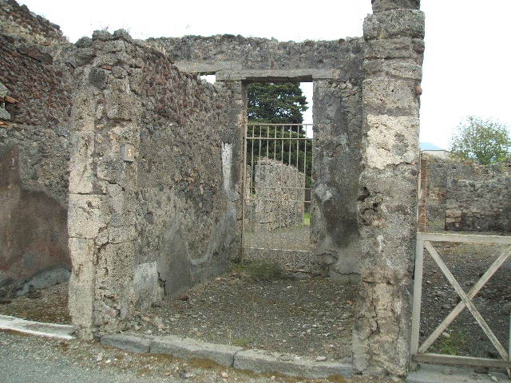 IX.9.3 Pompeii. May 2006. Entrance to shop, looking south to door in rear wall linking to atrium of IX.9.4.