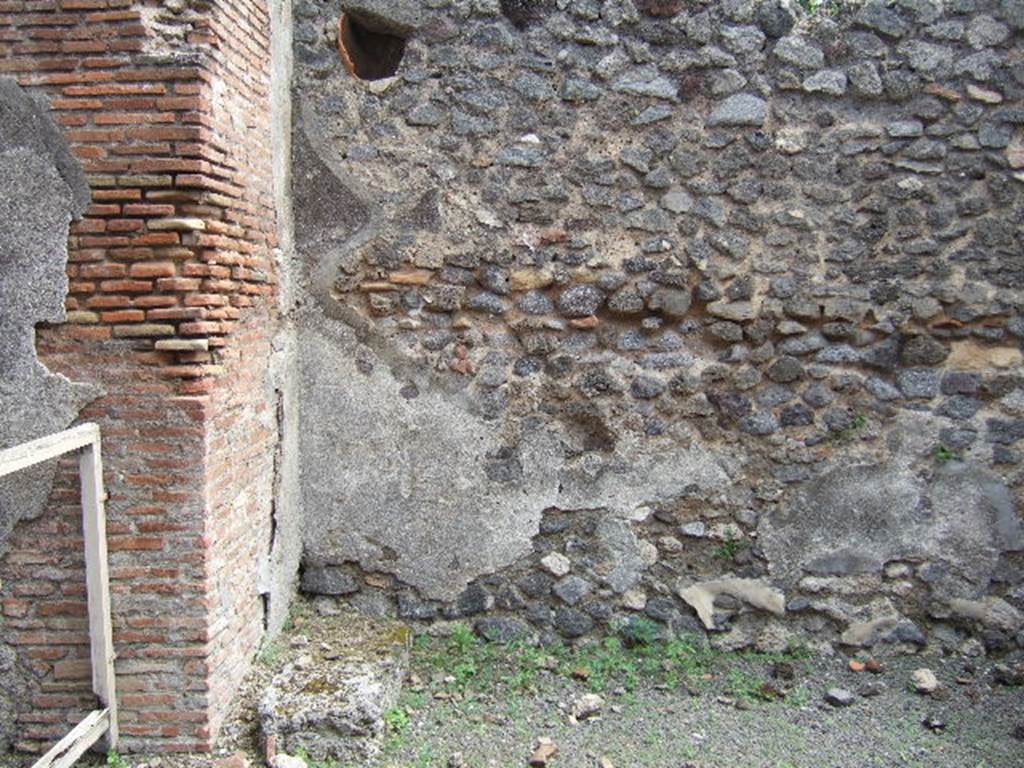 IX.9.6 Pompeii. May 2006. East side of atrium, with base of stairs to upper floor.
