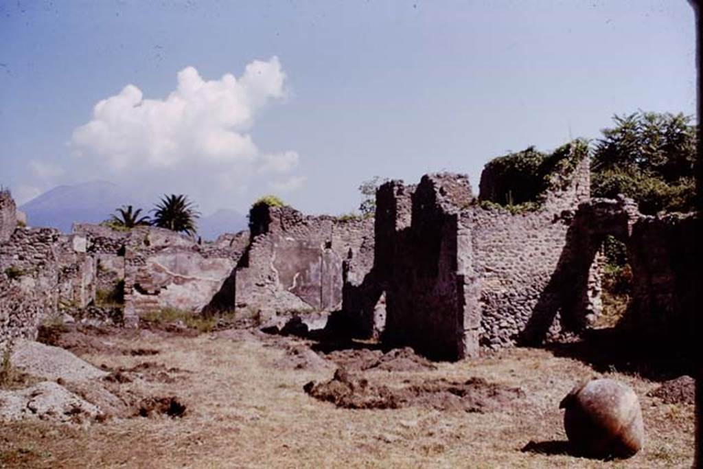 IX.9.6/10 Pompeii. 1964. Looking north across garden and the soil excavations. According to Wilhelmina, in this season they started with a trench towards the front of the garden.
Eventually they opened six trenches, each about the same size as they had put in the previous time, but without excavating the entire width of garden. They felt it was unnecessary to excavate the entire garden, as they soon found roots in the trenches, which they marked at regular intervals. These regular cavities made it obvious they had found a vineyard. Photo by Stanley A. Jashemski.
See Jashemski, W.F., 2014. Discovering the Gardens of Pompeii: Memoirs of a Garden Archaeologist. (p.121)
Source: The Wilhelmina and Stanley A. Jashemski archive in the University of Maryland Library, Special Collections (See collection page) and made available under the Creative Commons Attribution-Non Commercial License v.4. See Licence and use details.
J64f1269
