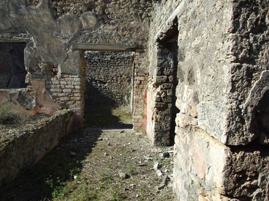 IX.9.13 Pompeii.  March 2009.  Looking north along the passageway on the east side of the garden, towards doorway to Room 13, Triclinium of IX.9.12, and on the right is the doorway to the Triclinium, Room 3.
