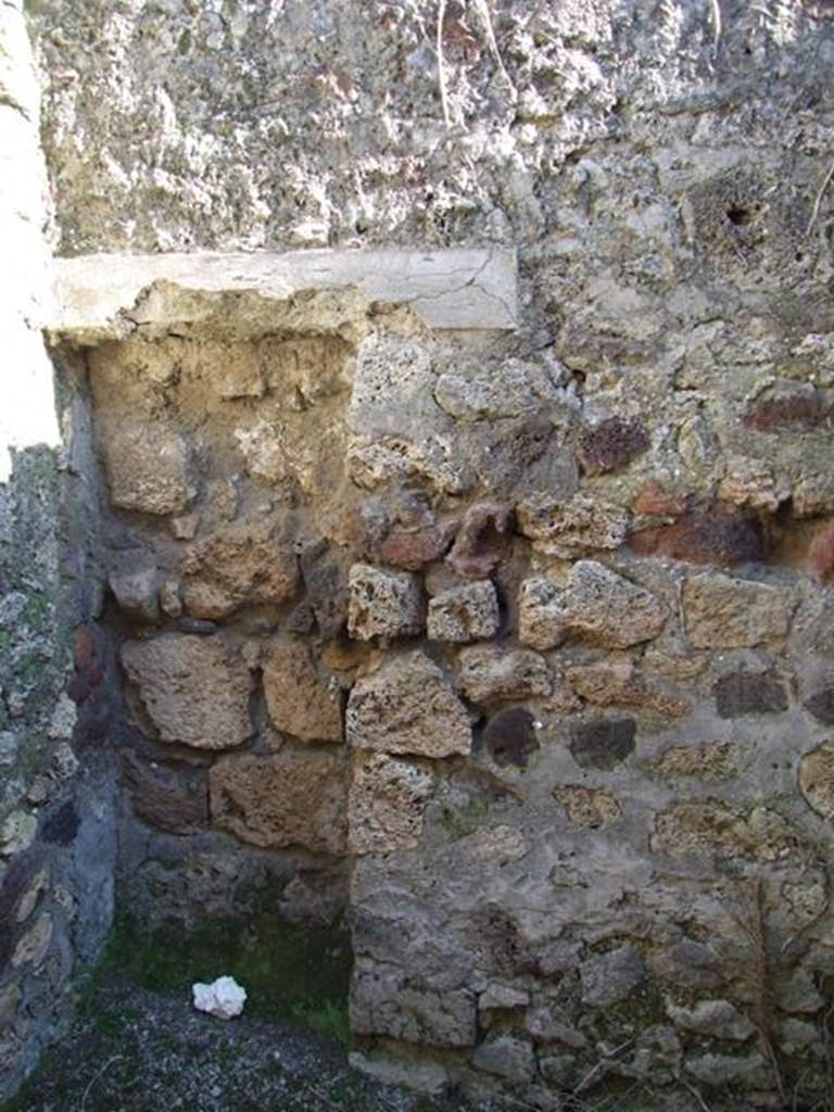 IX.9.b Pompeii.  March 2009. Area under stairs. Looking south to blocked doorway.

