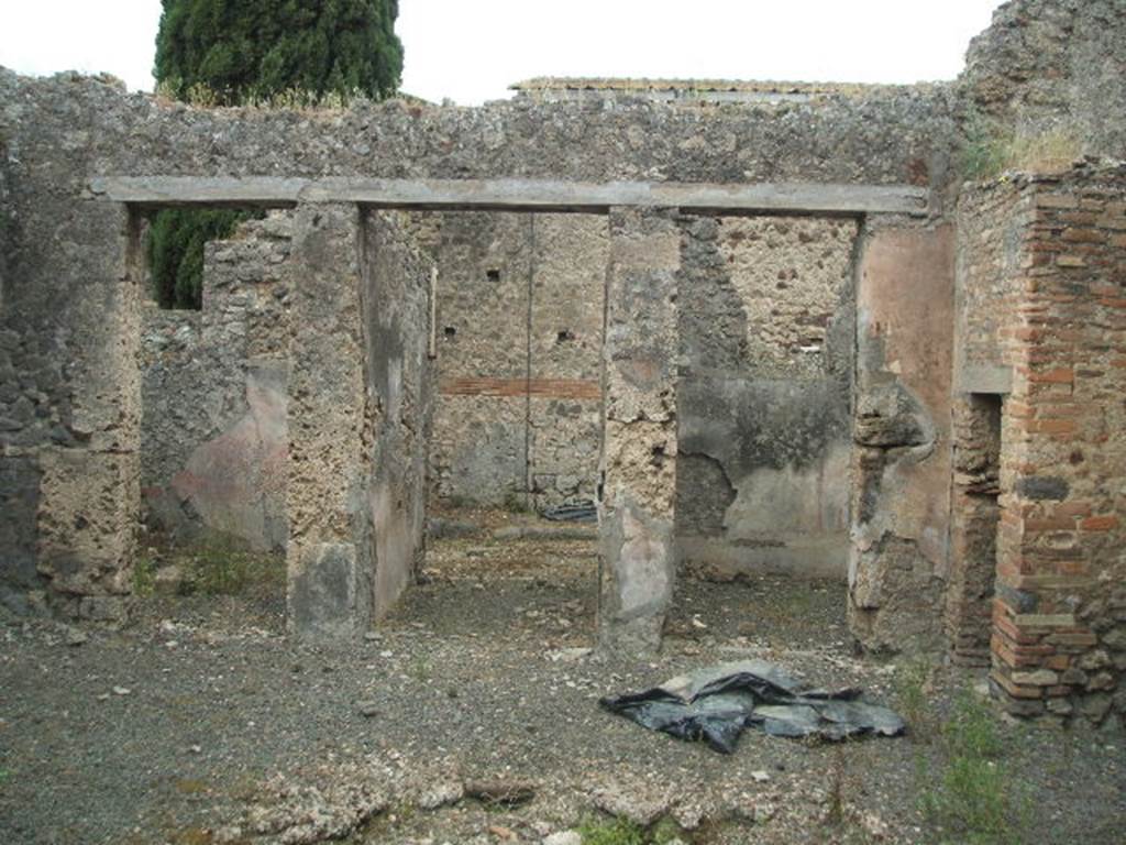 IX.9.d  Pompeii. May 2005.  Looking west across atrium b, to doorways to room k, entrance a, and rooms c and d.