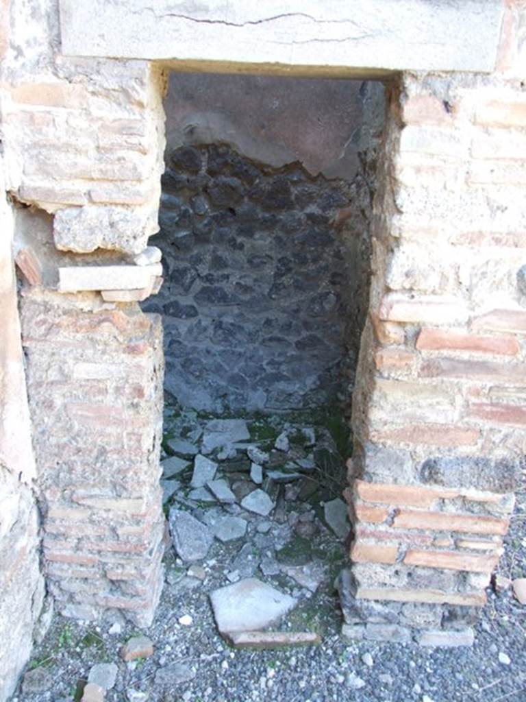 IX.9.d Pompeii.  March 2009. Doorway to Room d. Cupboard in north west corner of atrium.