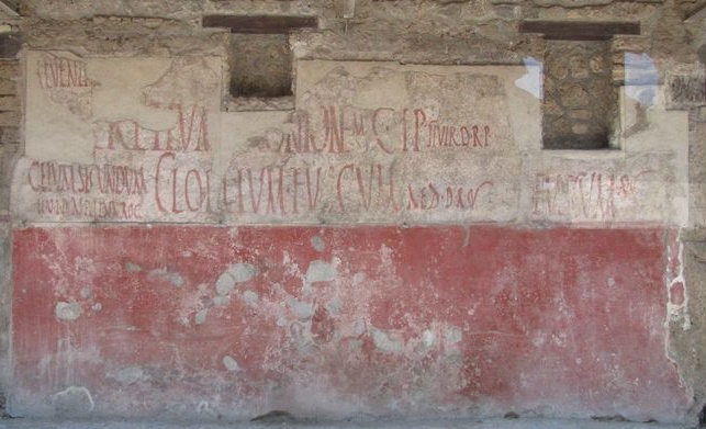 IX.11.3 Pompeii. Wall on east of entrance 3, between 3 and 4.  According to Varone and Stefani, the graffiti on the right of the doorway would read – CIL IV 7870, 7871, 7872, 7873, 7874, 7875 and 7876, with CIL IV 7875 no longer visible. See Varone, A. and Stefani, G., 2009. Titulorum Pictorum  Pompeianorum, Rome: L’erma di Bretschneider, (p.427)
According to Epigraphik-Datenbank Clauss/Slaby (See www.manfredclauss.de), these read as –
Calventium  IIvir(um)  o(ro)  v(os)  f(aciatis)       [CIL IV 7870]
M(arcum)  Lucretium  Frontonem       [CIL IV 7871]
C(aium)  I(ulium) P(olybium)  IIvir(um)  d(ignum)  r(ei)  p(ublicae)       [CIL IV 7872]
Ceium  Secundum 
IIv(irum)  i(ure)  d(icundo)  Asellina  rog(at)       [CIL IV 7873]
C(aium)  Lollium  Fuscum  aed(ilem)  d(ignum)  r(ei)  o(ro)  v(os)  f(aciatis)       [CIL IV 7874]
Cuspium  Pansam  aed(ilem)  o(ro)  v(os)  f(aciatis)       [CIL IV 7875]
Fuscum  aed(ilem)  o(ro)  v(os)  f(aciatis)       [CIL IV 7876]

