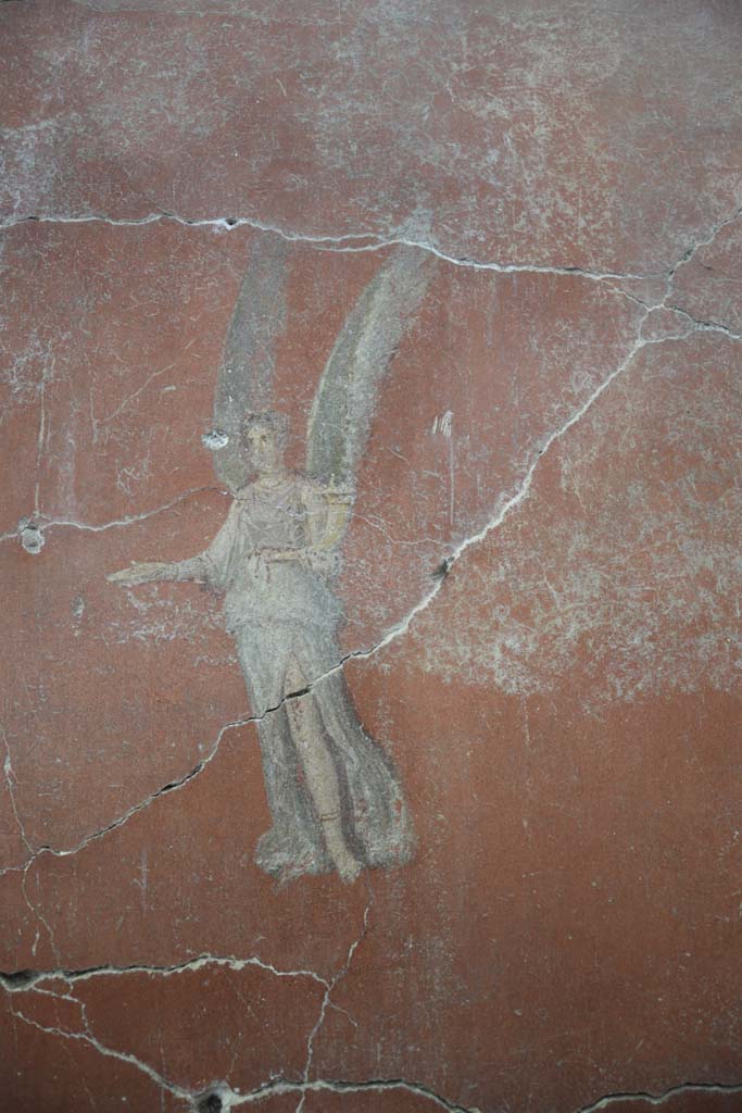 IX.12.6 Pompeii. February 2017. 
Room 3, painting of flying figure on east side of central painting on north wall.
Photo courtesy of Johannes Eber.
