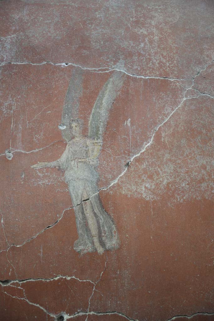 IX.12.6 Pompeii. February 2017. 
Room “m”, detail of flying figure on east side of central painting on north wall.
Photo courtesy of Johannes Eber.
.
