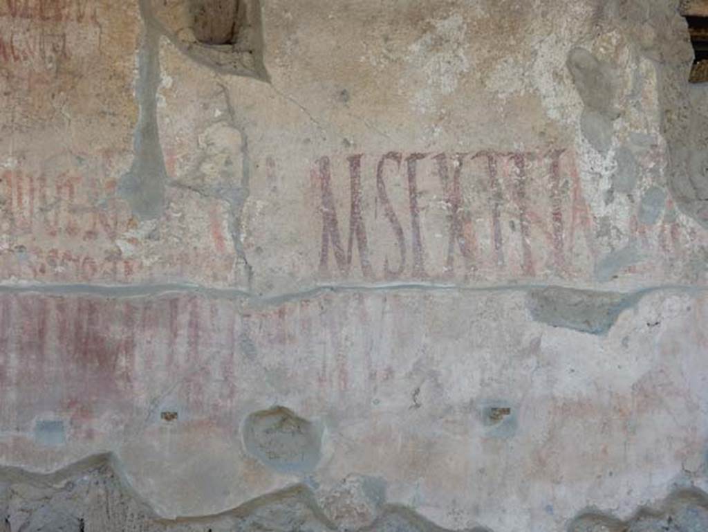 IX.12.7 Pompeii. May 2017. Detail of graffiti on west side of window opening between IX.12.6 and IX.12.7.  Photo courtesy of Buzz Ferebee.

