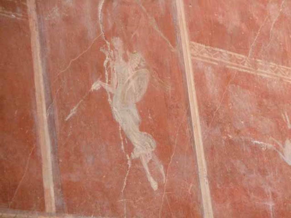 IX.12.9 Pompeii. May 2010. Room 14, north wall, upper zone. Painting of floating figure with spear and shield.