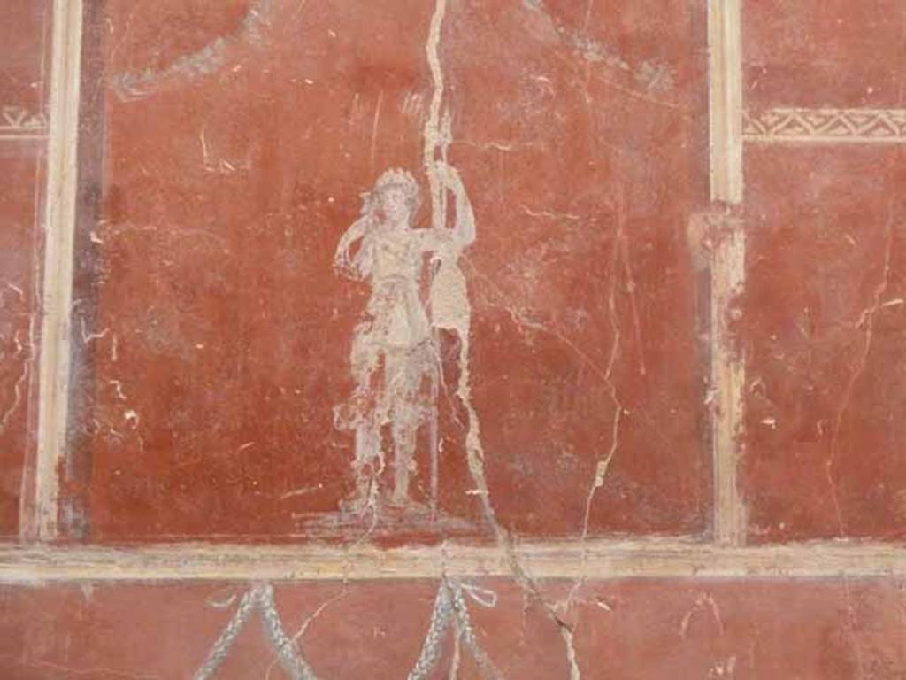 IX.12.9 Pompeii. May 2010. Room 14, east wall, upper zone, centre. Painting of figure with spear.