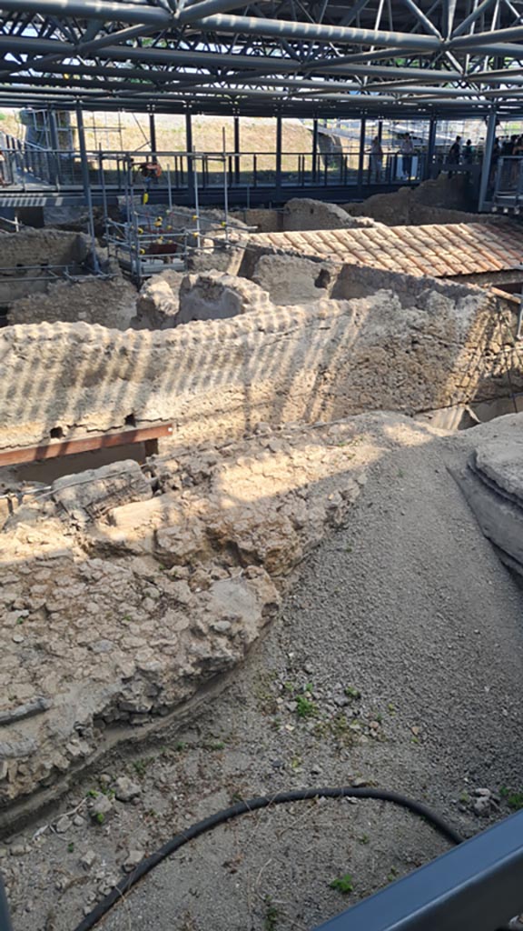 IX.12.A/IX.12.9 Pompeii. June 2024. 
Room 10, with collapsed wall, looking north-east from near doorway into room 2, centre left.  
Photo courtesy of Giuseppe Ciaramella.

