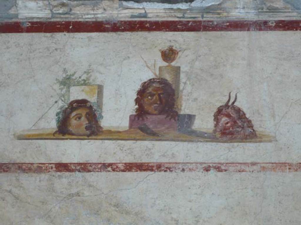 IX.13.1-3 Pompeii. May 2012.  Room 9, detail of painting from east wall.
Photo courtesy of Buzz Ferebee.
