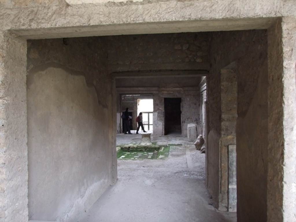 IX.13.1-3 Pompeii. March 2009. Room 14, looking south through window to atrium.