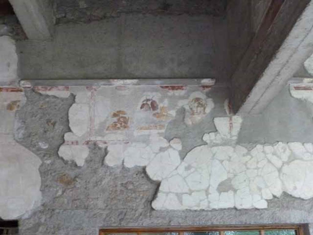 IX.13.1-3 Pompeii. May 2010.  Room 9, upper south wall above room 14.

