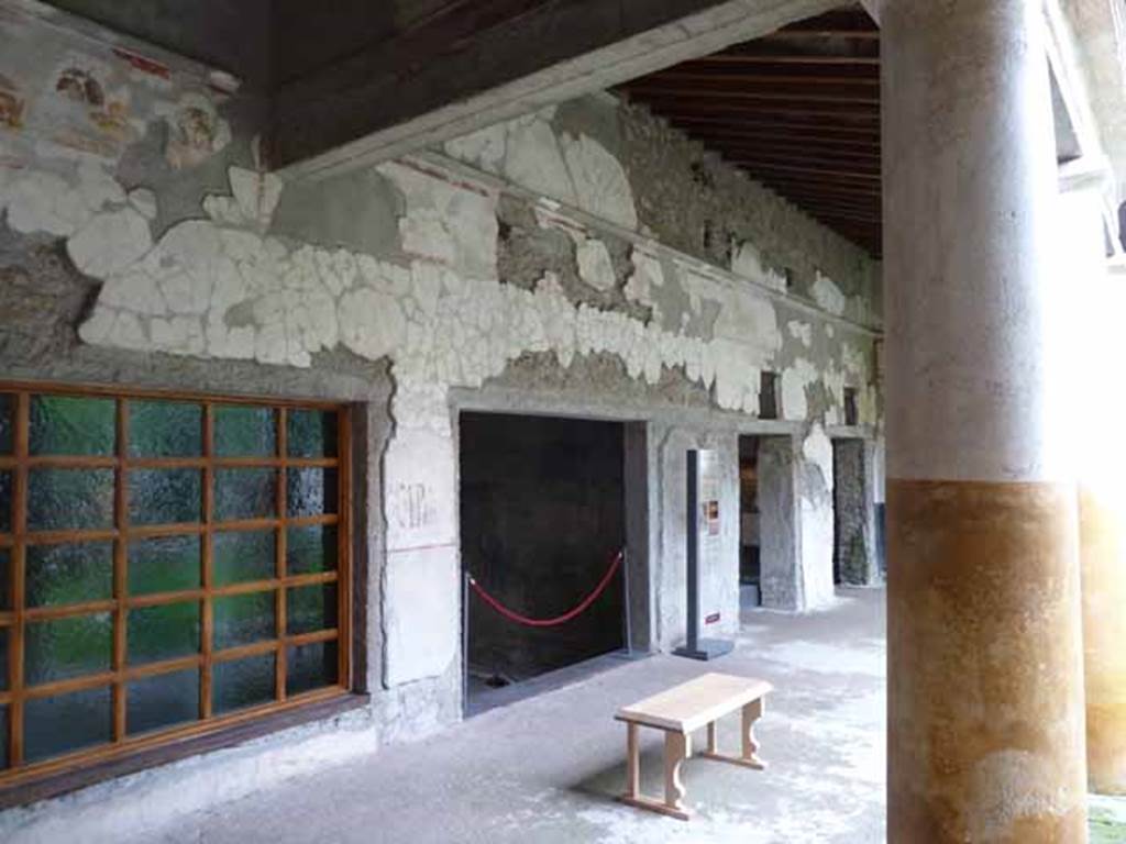 IX.13.1-3 Pompeii. May 2010. Room 9, looking west along south portico.