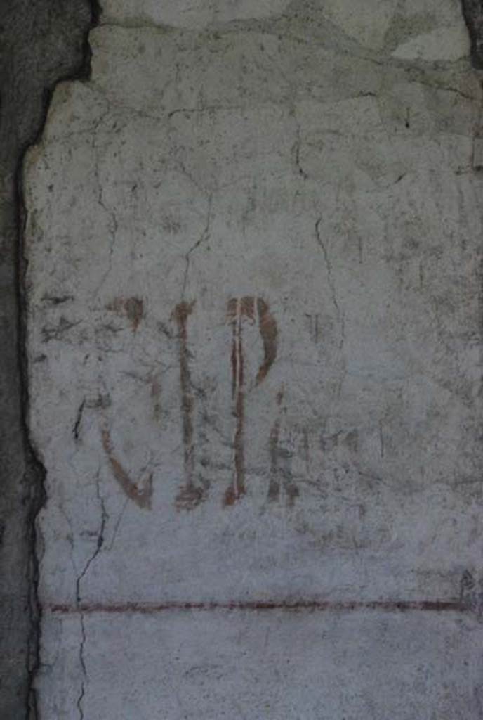 IX.13.1-3 Pompeii. October 2007. Detail of graffiti between the rooms 14 and 15.
Photo courtesy of Nicolas Monteix.
According to Giordano and Casale, this was found on 21st June 1972 written in red on a pilaster on the south side of the peristyle. C(aium) . I(ulium) . P(olibium) . II . VIR
See Giordano, C and Casale, A: Iscrizioni Pompeiane Inedite Scoperte Tra Gli Anni 1954-1978, (p.284).
