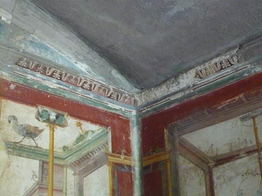 IX.13.1-3 Pompeii. May 2012. Room 17, painted figure from upper centre of east wall.
Photo courtesy of Buzz Ferebee.
