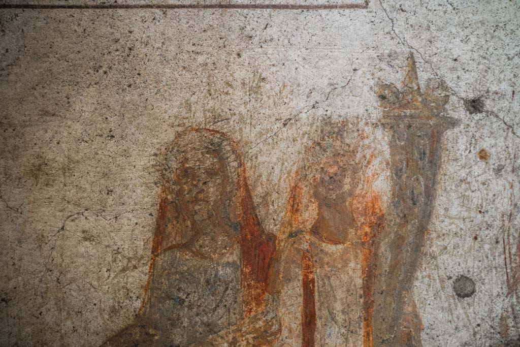 IX.13.1-3 Pompeii. October 2021. 
Room 21, detail from lararium. Photo courtesy of Johannes Eber.

