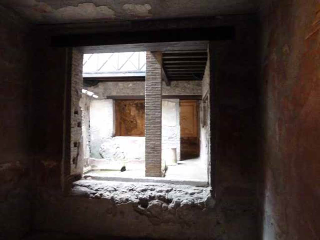 IX.13.1-3 Pompeii. May 2010. Room 25, looking north through window into kitchen courtyard, towards room 22.
