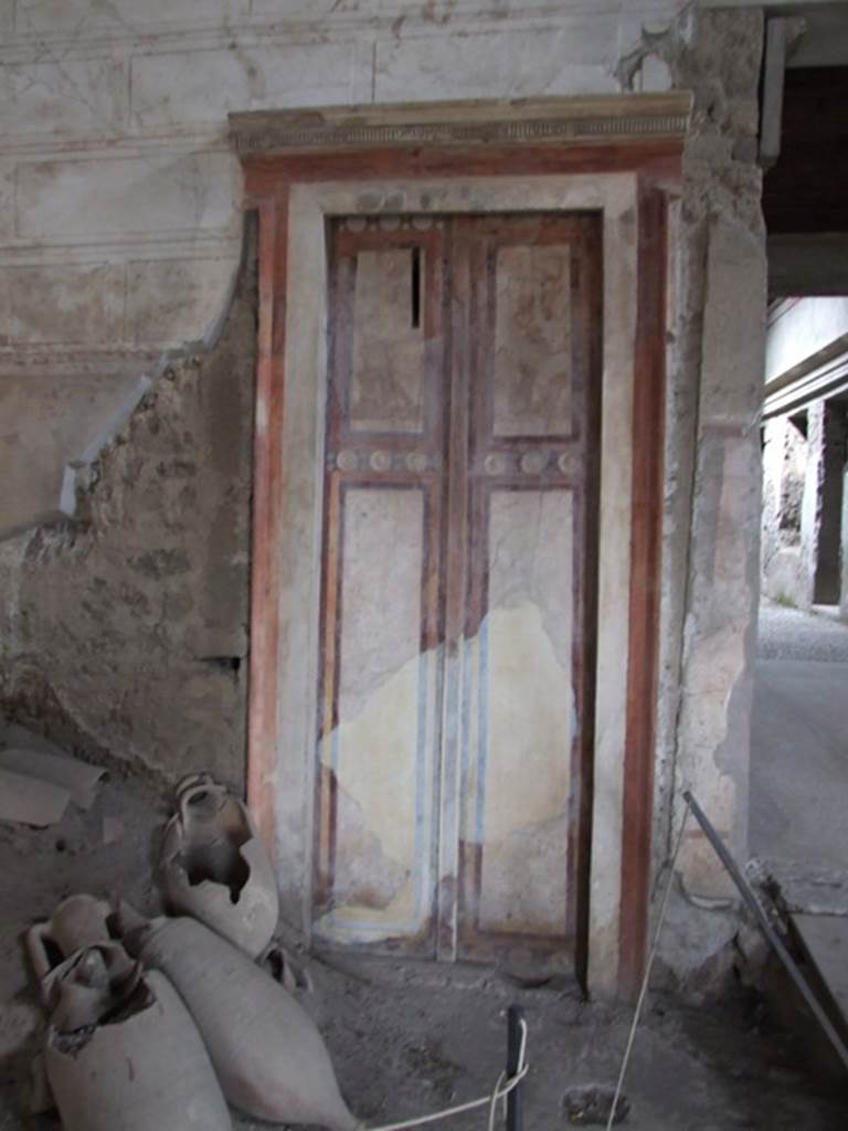 IX.13.1-3 Pompeii. March 2009. Room 1, painted false door in north wall.