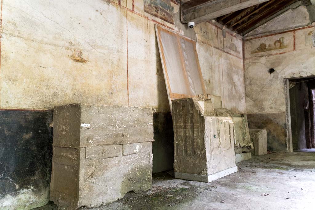 IX.13.3 Pompeii. October 2021. 
Room 9, plaster casts of cupboards or chests against east wall of portico in south-east corner. Photo courtesy of Johannes Eber.
