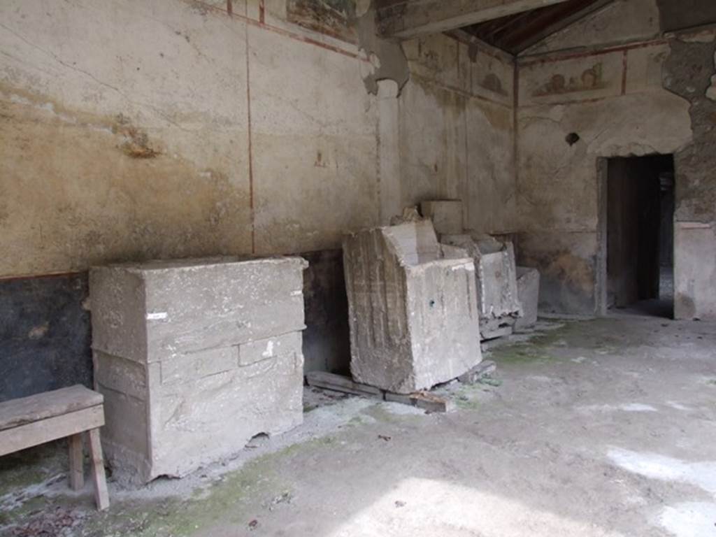 IX.13.1-3 Pompeii. March 2009. Room 9, plaster casts of cupboards or chests against east wall of portico.