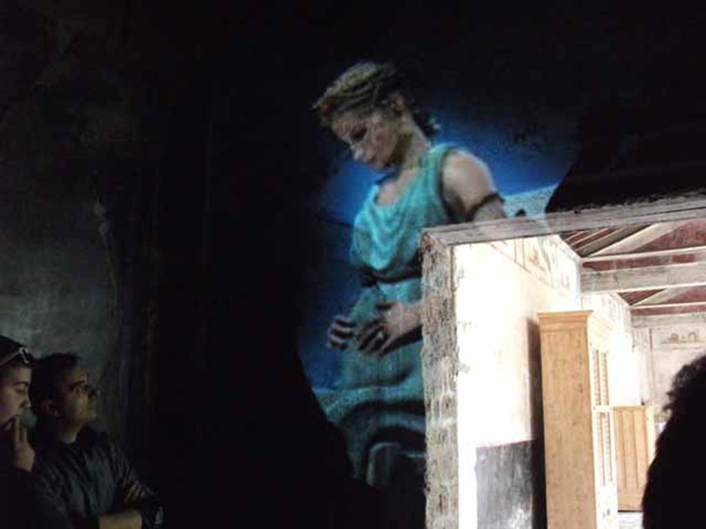 IX.13.1-3 Pompeii. May 2010.  Room 10, hologram of the daughter of Julius Polybius.