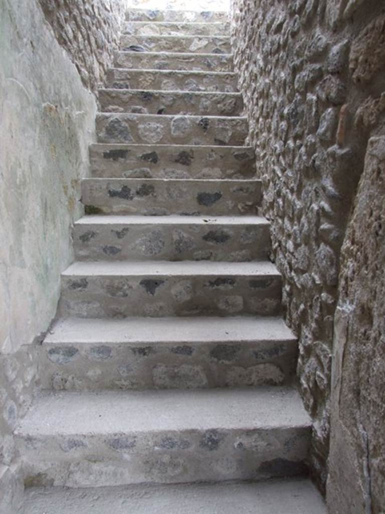 IX.14.4 Pompeii. December 2007. Staircase (m) in south-west corner giving access to rear upper level.