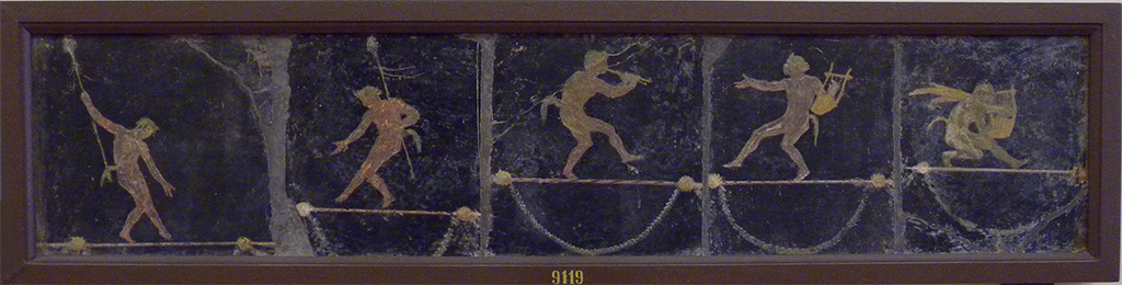 HGW06 Pompeii. Found in triclinium on 18 January 1749.  
Wall painting of acrobatic Satyrs with Thyrsi and musical instruments.
Now in Naples Archaeological Museum. Inventory number 9119.
