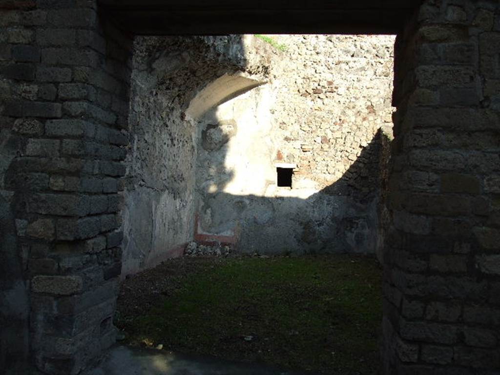 HGW24 Pompeii. December 2006. Looking east through window into a large room in south-east corner of garden area. 
(Fontaine, room 5,5).
According to the plan of La Vega, no.84 would have been found in the east portico outside of this window.
