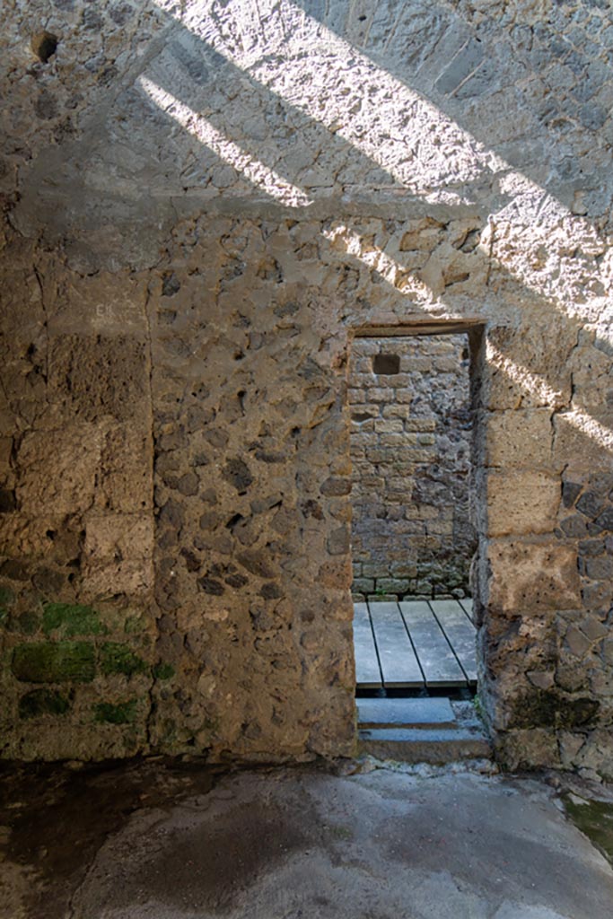 Villa of Mysteries, Pompeii. October 2023. 
Room 48-9, doorway in west wall leading into corridor 27. Photo courtesy of Johannes Eber.
