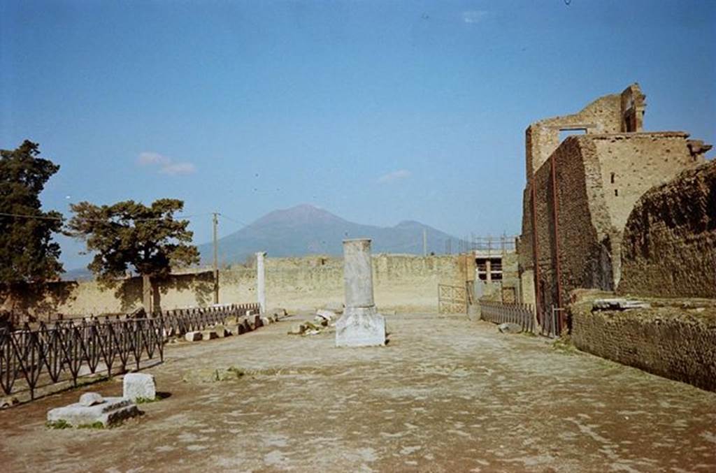 VIII.1.3 Pompeii. January 2010. Looking north to entrance and Vesuvius, from south-east corner. The Unnamed vicolo between VIII.1.3 and VIII.1.1 is behind the far-right fence. Photo courtesy of Rick Bauer.
