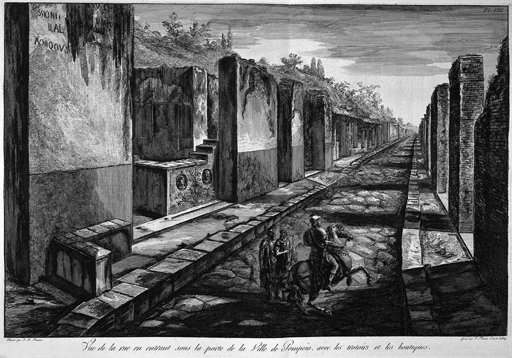 Via Consolare, Pompeii. Pre-1778 drawing by G. B. Piranesi, published by F Piranesi in 1804. 
Looking south, with the bar-counter with decorative heads at VI.1.2. visible on the left.
Foto Taylor Lauritsen, ERC Grant 681269 DÉCOR.
See Piranesi, F, 1804. Antiquités de la Grande Grèce: Tome I. Paris: Piranesi and Le Blanc, Pl. VIII.

