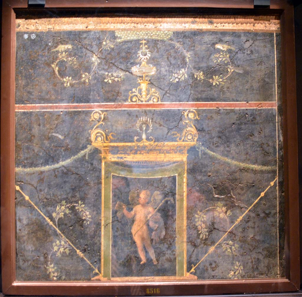 VI.17.9-11 Pompeii or Via Consolare. Painting with tholos, dolphins and winged cupid with a pedum.
Now in Naples Archaeological Museum. Inventory number 8516.
